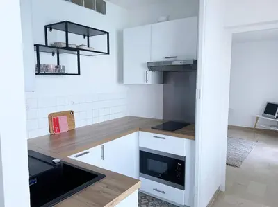 Cuisine ou kitchenette dans l'établissement Appartement en bord de mer