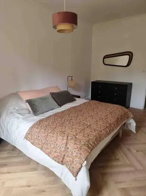 Un ou plusieurs lits dans un hébergement de l'établissement Appartement au cœur de la ville
