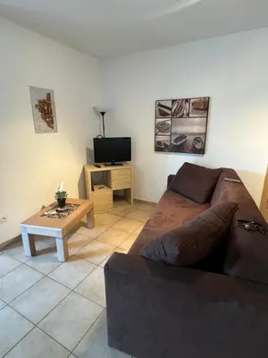 Télévision ou salle de divertissement dans l'établissement Charmant appartement dans résidence avec piscines