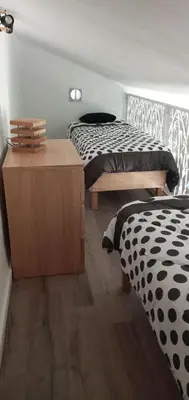 Un ou plusieurs lits dans un hébergement de l'établissement maison climatisée 150 m de la mer