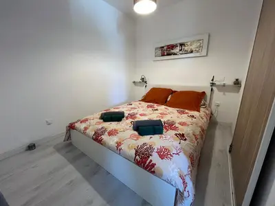 Un ou plusieurs lits dans un hébergement de l'établissement Appartement vue mer imprenable.