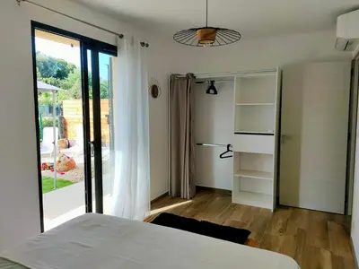Un ou plusieurs lits dans un hébergement de l'établissement Jardin et 2 chambres centre St Florent
