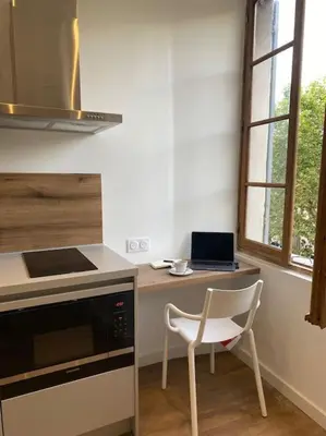 Cuisine ou kitchenette dans l'établissement Place Saint Nicolas - Centre Ville Bastia
