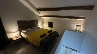 Un ou plusieurs lits dans un hébergement de l'établissement Appartements de Charme