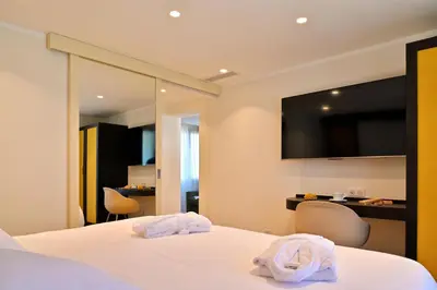 Un ou plusieurs lits dans un hébergement de l'établissement HOTEL SAINT ROCH
