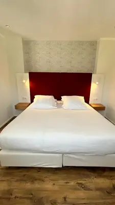 Un ou plusieurs lits dans un hébergement de l'établissement HOTEL SAINT ROCH