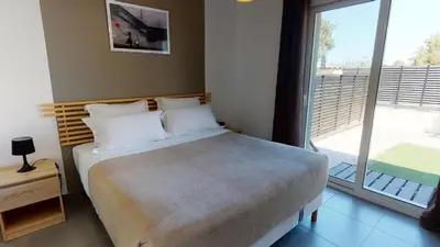 Un ou plusieurs lits dans un hébergement de l'établissement Residence Villa Branda