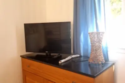 Télévision ou salle de divertissement dans l'établissement Villa La Casa de Giuseppe