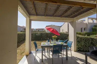 Balcon ou terrasse dans l'établissement MAISONNETTE LOZARI 4 PERS PROCHE L'ILE ROUSSE