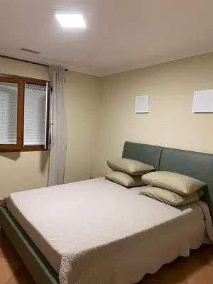 Un ou plusieurs lits dans un hébergement de l'établissement Appartements 300 mètres de la mer et villa