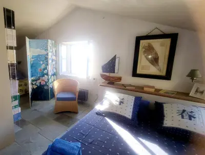 Un ou plusieurs lits dans un hébergement de l'établissement CABANON PETRONILLE