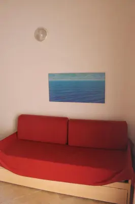 Coin salon dans l'établissement Trilocale in residence con piscina a 200 m dal mare