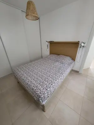Un ou plusieurs lits dans un hébergement de l'établissement Residence Marina di Bravone