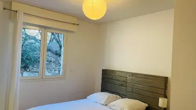Un ou plusieurs lits dans un hébergement de l'établissement Appartement Le Domaine L'ILE ROUSSE