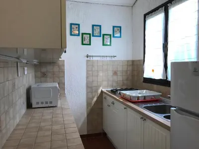 Cuisine ou kitchenette dans l'établissement Appartement T2 Solane 35 LUMIO