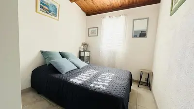 Un ou plusieurs lits dans un hébergement de l'établissement Appartement T3 Boug 15 LUMIO