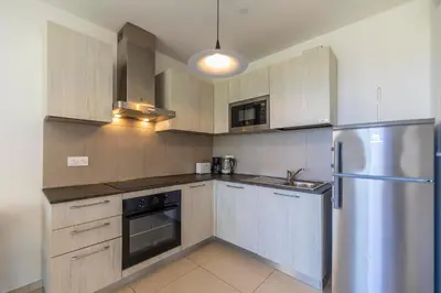 Cuisine ou kitchenette dans l'établissement Residence A Marina