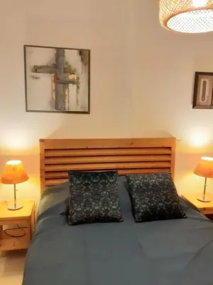 Un ou plusieurs lits dans un hébergement de l'établissement Bel appartement avec piscine- Poggio Mezzana