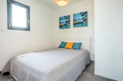 Un ou plusieurs lits dans un hébergement de l'établissement Stella di Luce - Appt climatisé vue mer