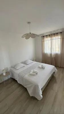 Un ou plusieurs lits dans un hébergement de l'établissement Appartement T4