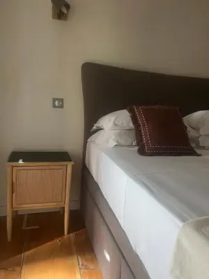Un ou plusieurs lits dans un hébergement de l'établissement Appartement prestige, cour Paoli
