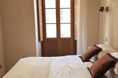 Un ou plusieurs lits dans un hébergement de l'établissement Appartement prestige, cour Paoli