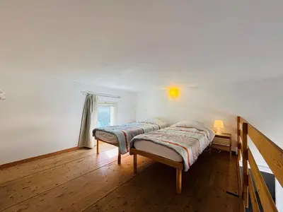 Un ou plusieurs lits dans un hébergement de l'établissement Appartement Libeccio 41 LUMIO