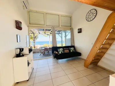Coin salon dans l'établissement Appartement Libeccio 41 LUMIO