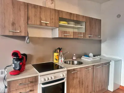 Cuisine ou kitchenette dans l'établissement Studio les pieds dans l eau