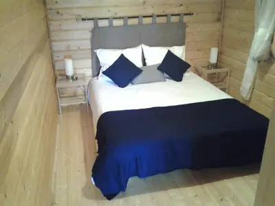 Un ou plusieurs lits dans un hébergement de l'établissement Les Chalets De Lozzi