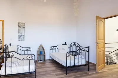 Un ou plusieurs lits dans un hébergement de l'établissement Villa A Surgenta