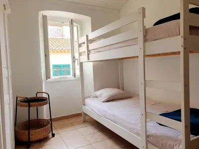 Un ou plusieurs lits dans un hébergement de l'établissement Appartement à 2 mn a pied de la plage L'Ile Rousse Corse