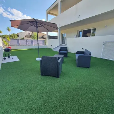 Coin salon dans l'établissement appartement Oliviaaxelle