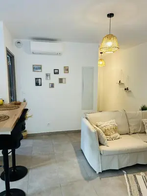 Coin salon dans l'établissement Appartement T2 Corte