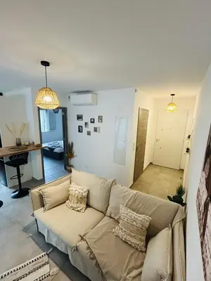 Coin salon dans l'établissement Appartement T2 Corte