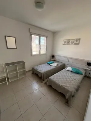 Un ou plusieurs lits dans un hébergement de l'établissement Corse villa T3 piscine