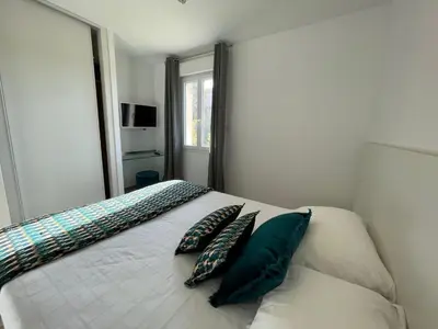 Un ou plusieurs lits dans un hébergement de l'établissement Residence Des Îles