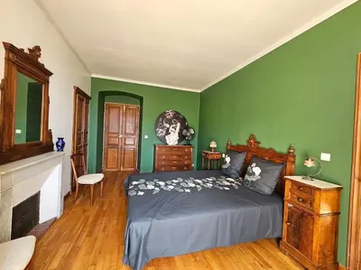 Un ou plusieurs lits dans un hébergement de l'établissement Maison d Americain a Figarella au Cap Corse