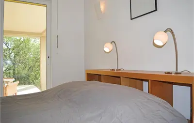 Un ou plusieurs lits dans un hébergement de l'établissement Cozy Home In San Giuliano With Wifi