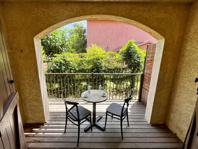 Balcon ou terrasse dans l'établissement Studio confortable avec piscine