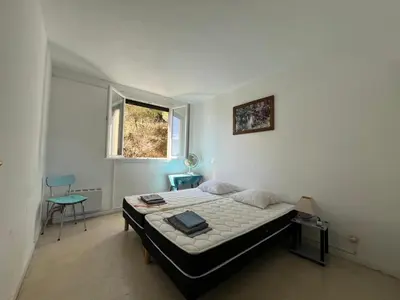 Un ou plusieurs lits dans un hébergement de l'établissement Appartement vintage Bastia - MAGNIFIQUE VUE !