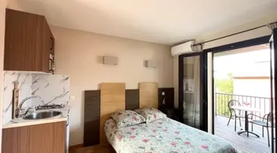 Un ou plusieurs lits dans un hébergement de l'établissement Soleil, Piscine, Parking et Bienvenue à Sisco