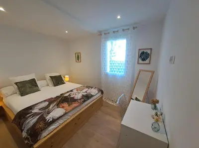 Un ou plusieurs lits dans un hébergement de l'établissement Appartement T2 rez-de-villa