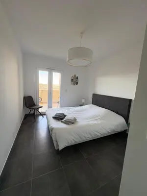 Un ou plusieurs lits dans un hébergement de l'établissement Appartement Rossignol