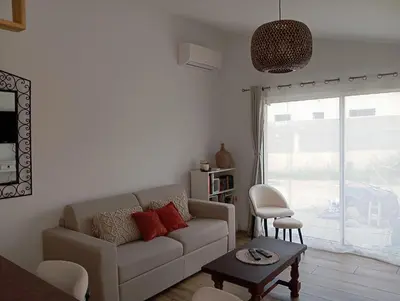 Coin salon dans l'établissement Maisonnette 55m2 Lozari