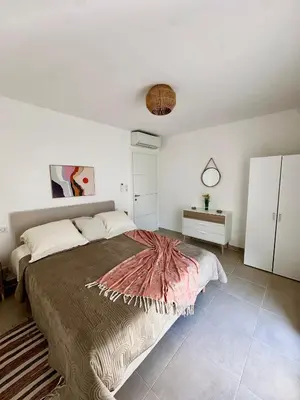 Un ou plusieurs lits dans un hébergement de l'établissement Appartement HARMONIE
