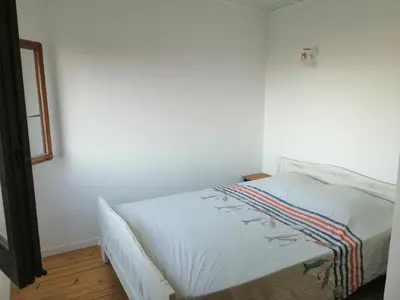 Un ou plusieurs lits dans un hébergement de l'établissement Maison bord de mer climatisée en Corse