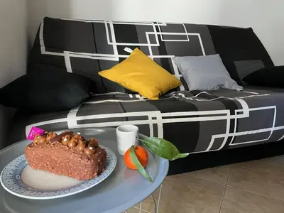 Un ou plusieurs lits dans un hébergement de l'établissement Appartement Jardin de la Mer