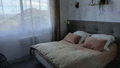 Un ou plusieurs lits dans un hébergement de l'établissement Maison de village 3 chambres vue mer