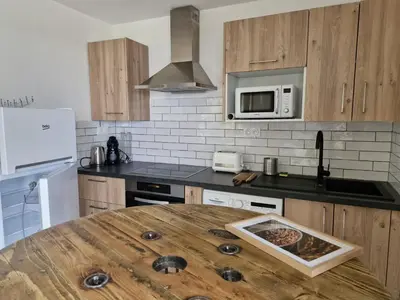 Cuisine ou kitchenette dans l'établissement Vos vacances à 3 minutes de la mer
